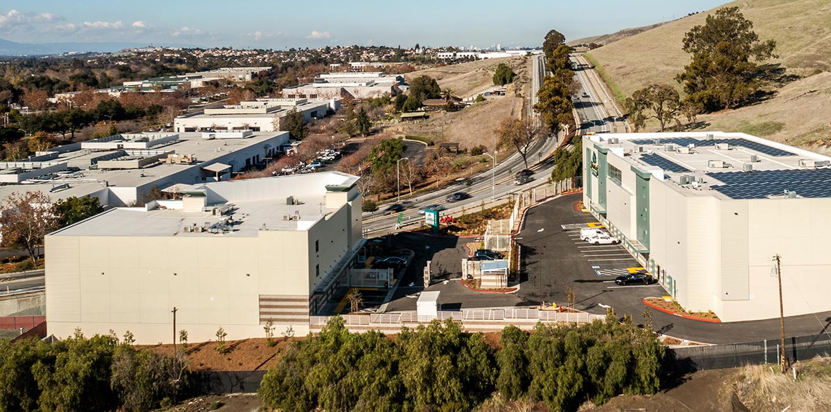 Daytime landscape aerial photograph side view of Silver Creek Self Storage buildings located on the main thoroughfare of Silver Creek Valley Road in San José, California