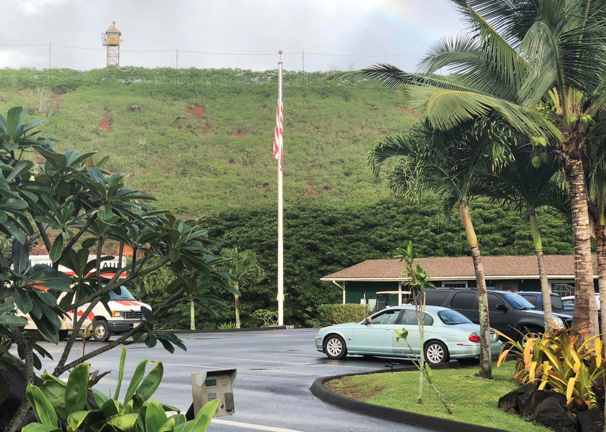 American Flag on a pole at a storage unit parking lot