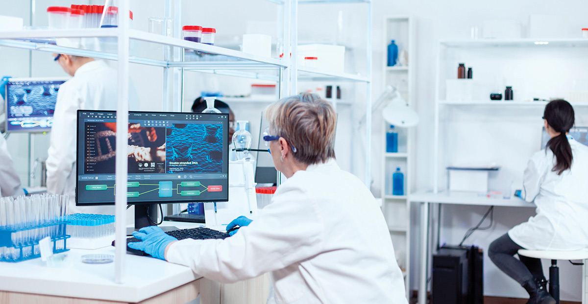 Lab tech on computer