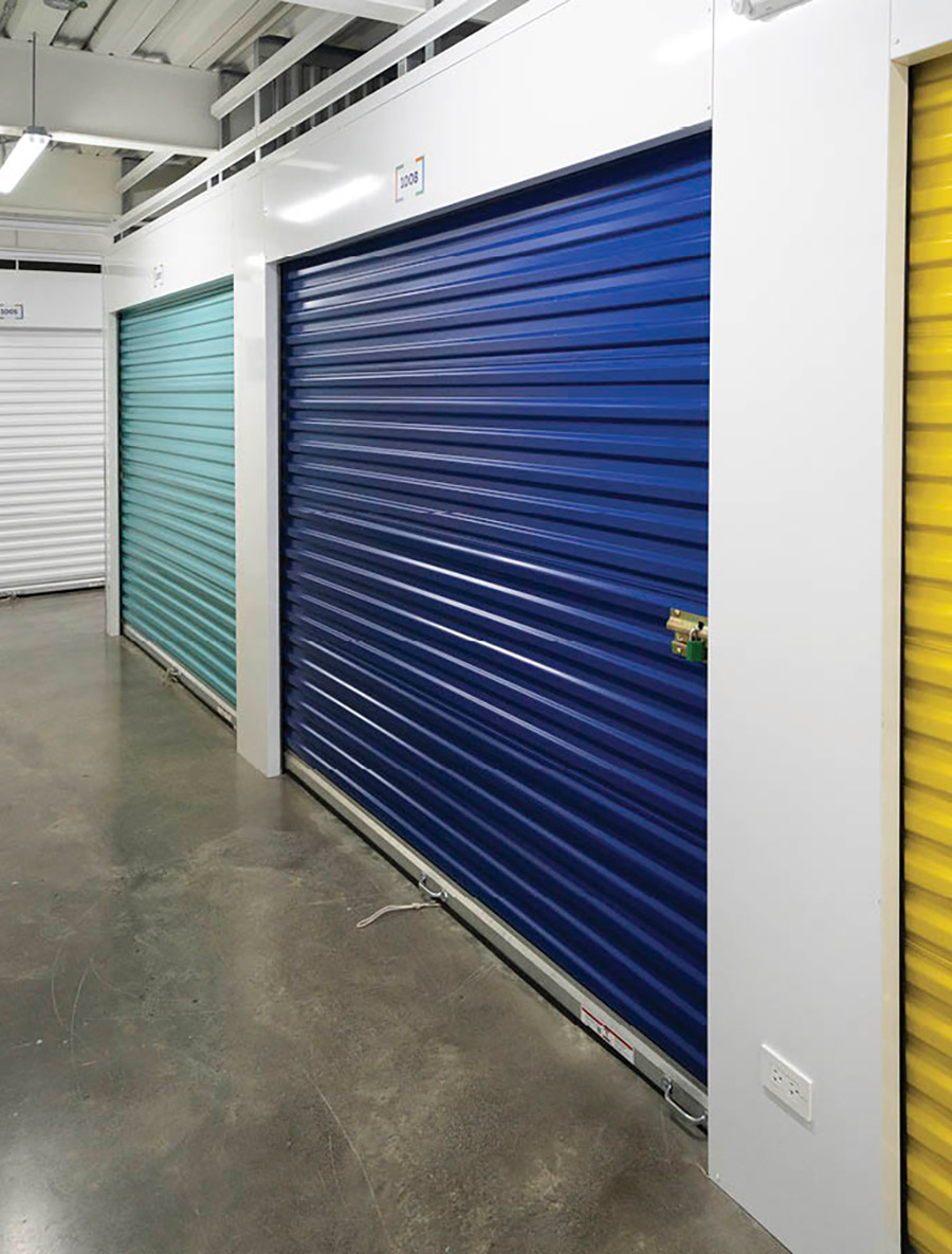 large storage units with different colored entry doors