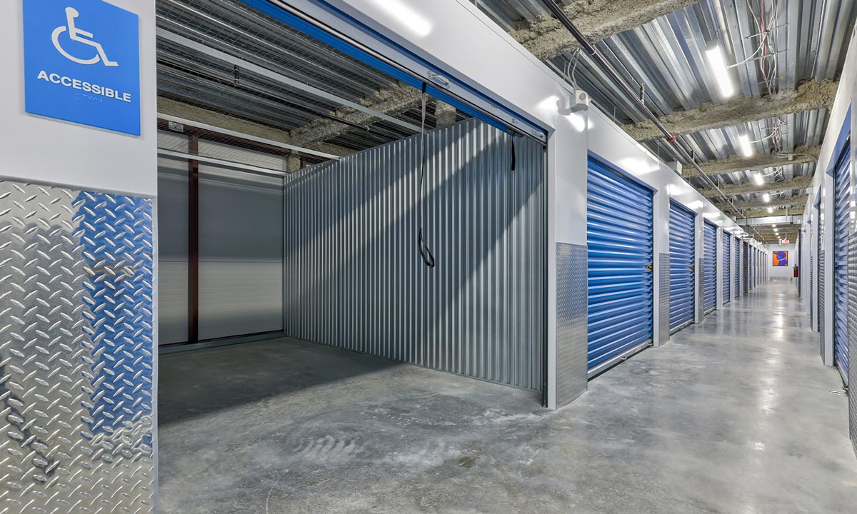a Morningstar storage block hallway with a wheelchair accessible unit open for view
