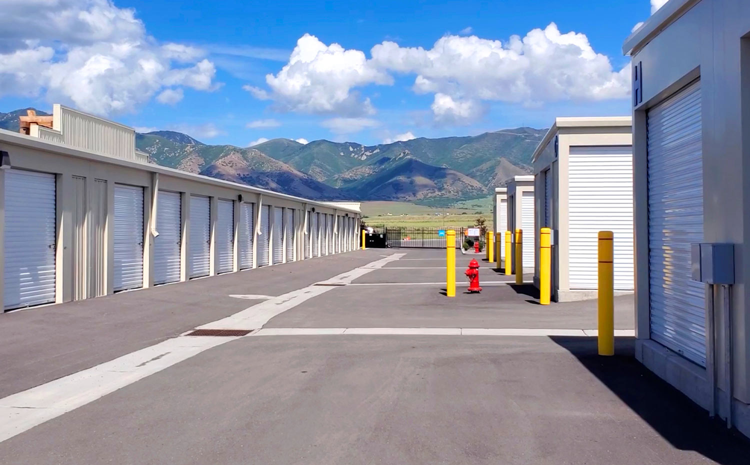 view down a storage block alley way, including a view of the Utah mountains beyond the StoreEase facility