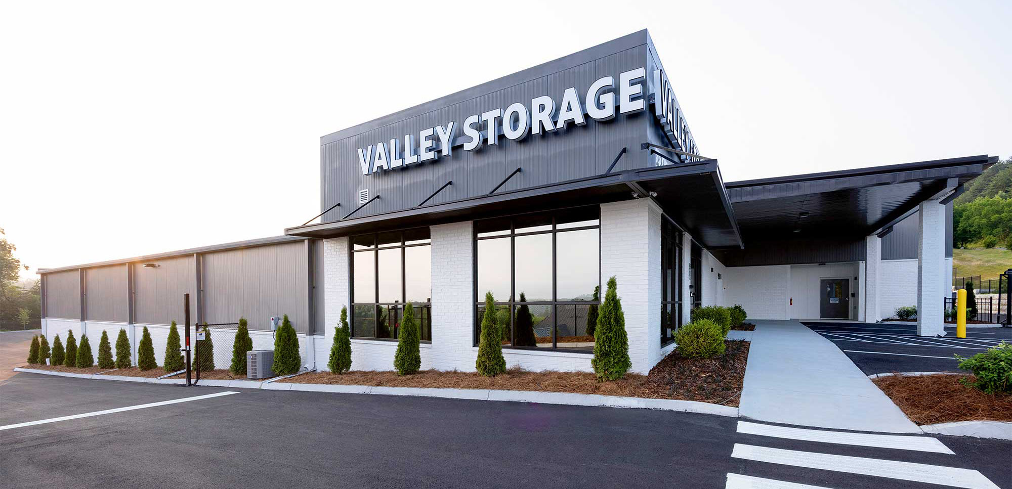 front view of Valley Storage building with accent greenery