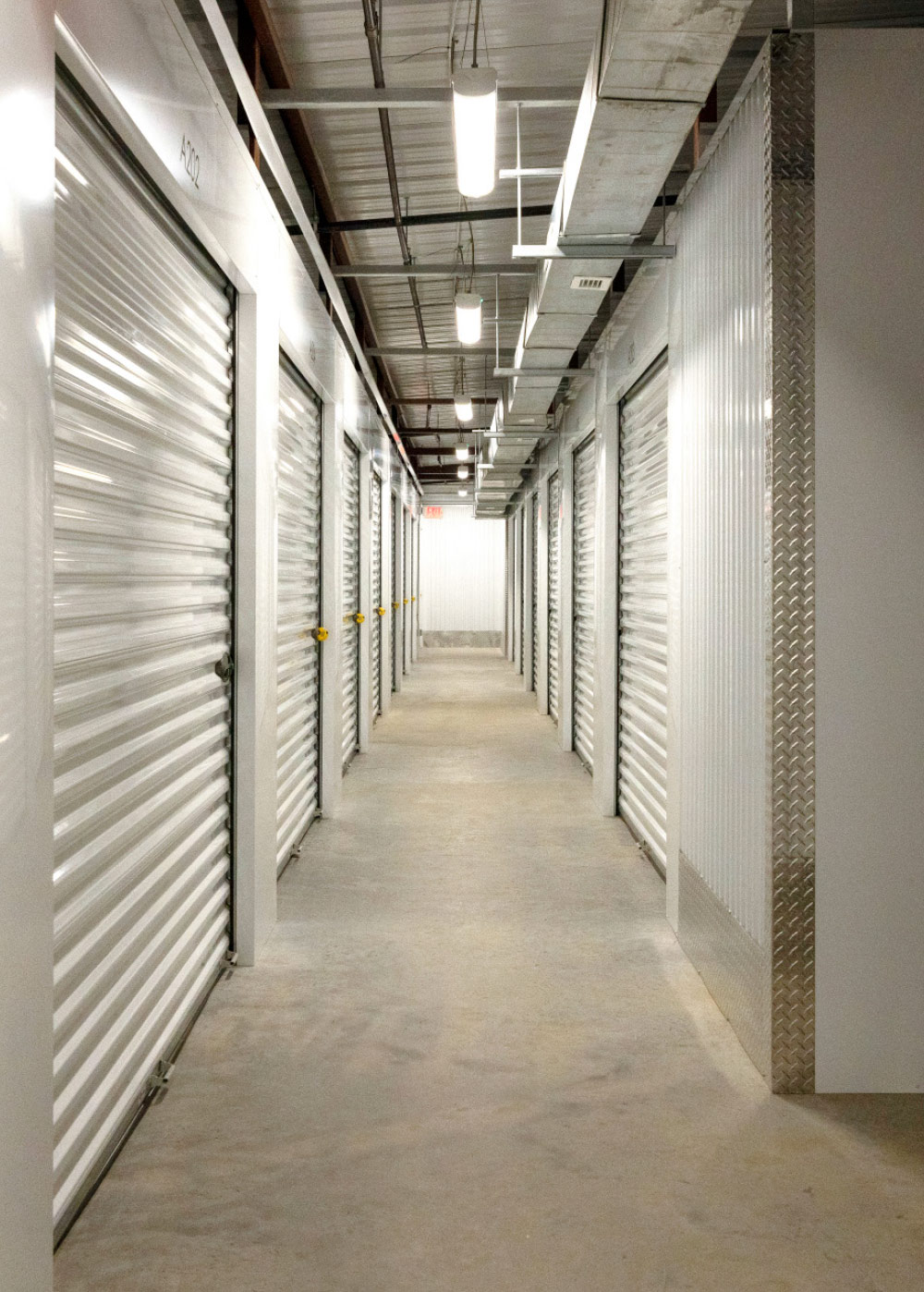 storage hallway with multiple doors for units