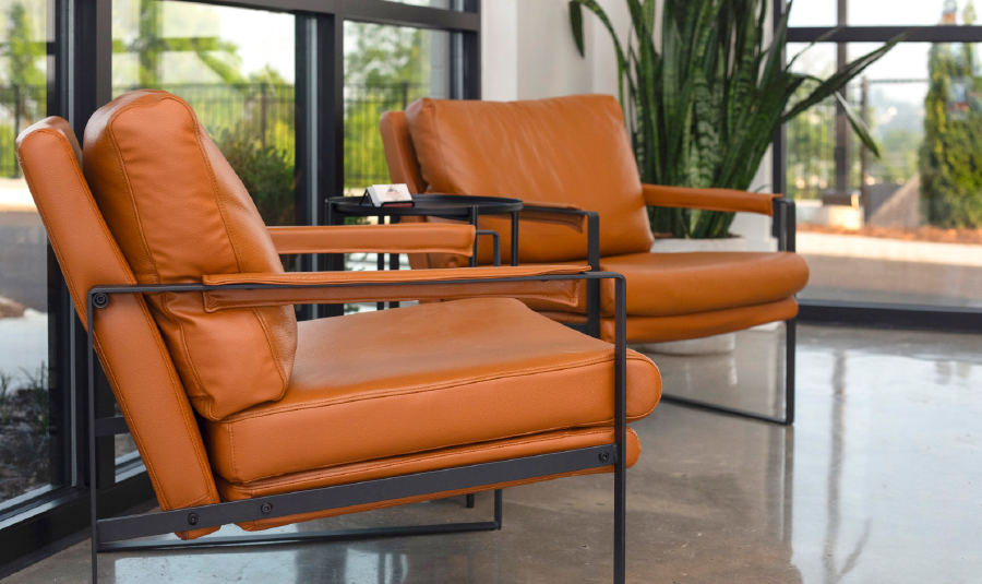 two orange leather accent chairs