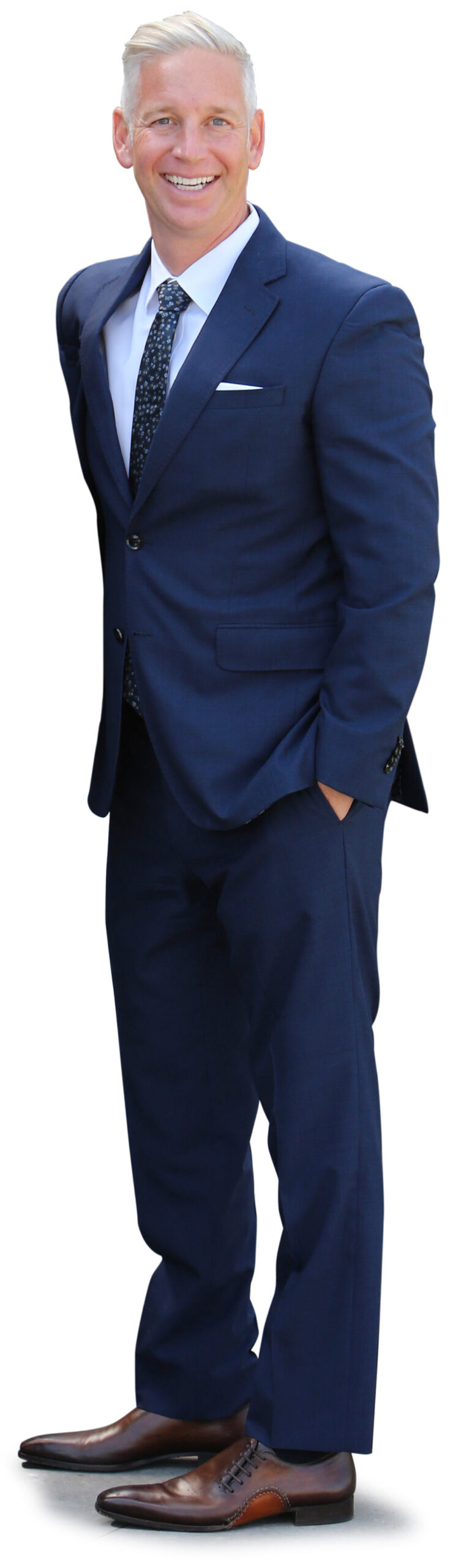 Noah Springer in navy blue suit