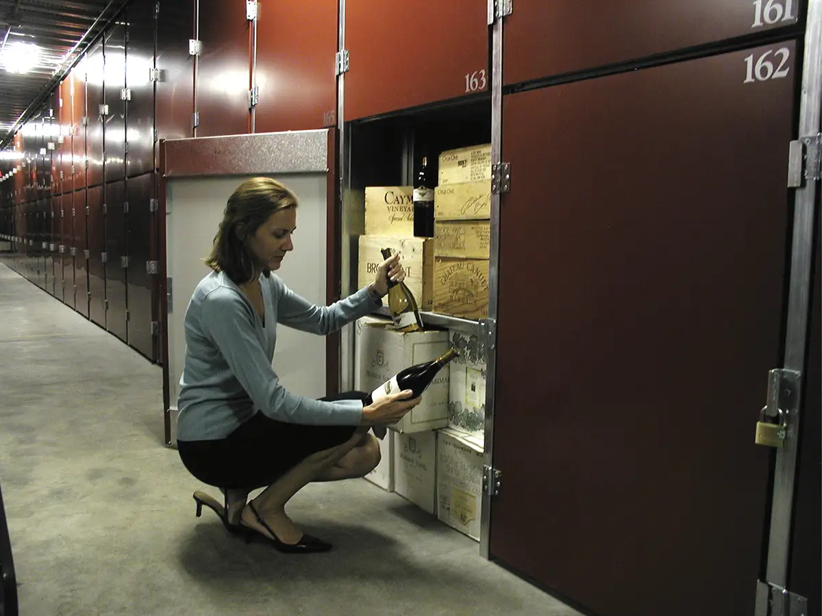 woman examining wine bottle in StorBox Self Storage facilities