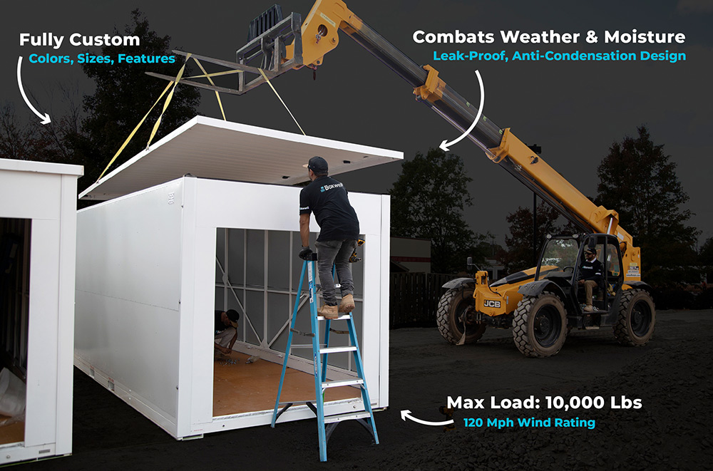 person standing on ladder to work on storage building 