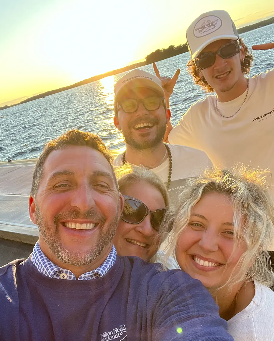 Barnholdt family posing by the water