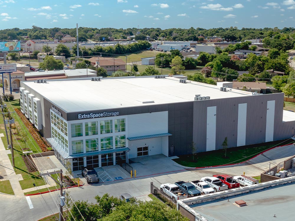 drone view of the multi-story Extra Space Storage in Fort Worth, Texas and the surrounding area