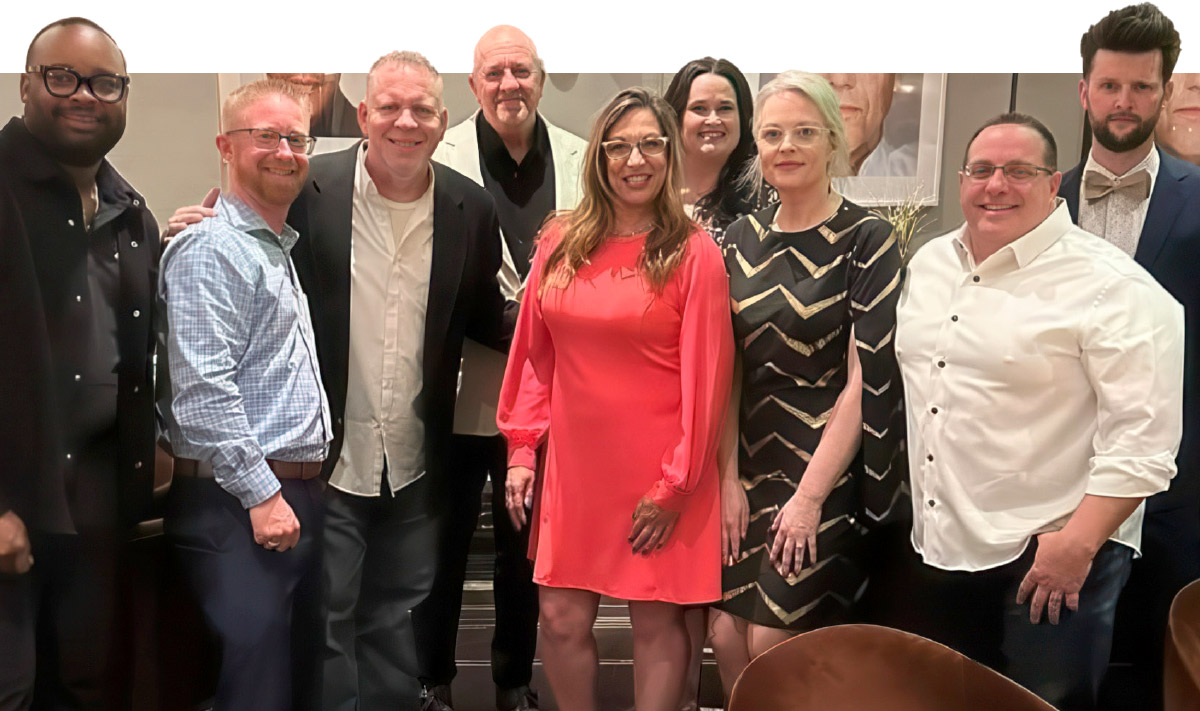 group photo of Curtis Burns, Chance Nelson, John Traver, Sherry Miller, Shannon Charbonneau, Jennifer Downer, Andy Stavros, and Grant the Mentalist
