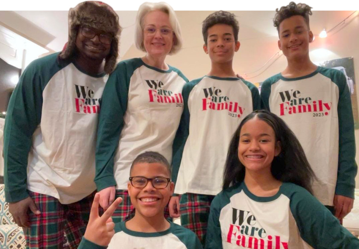 Jennifer Downer and her family wearing holiday themed pajamas 