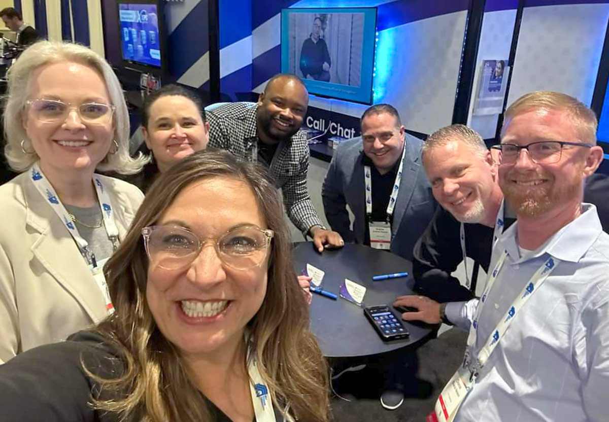 group selfie of Jennifer Downer, Sherry Miller, Shannon Charbonneau, Curtis Burns, Andy Stavros, Richard Huxley, and Chance Nelson