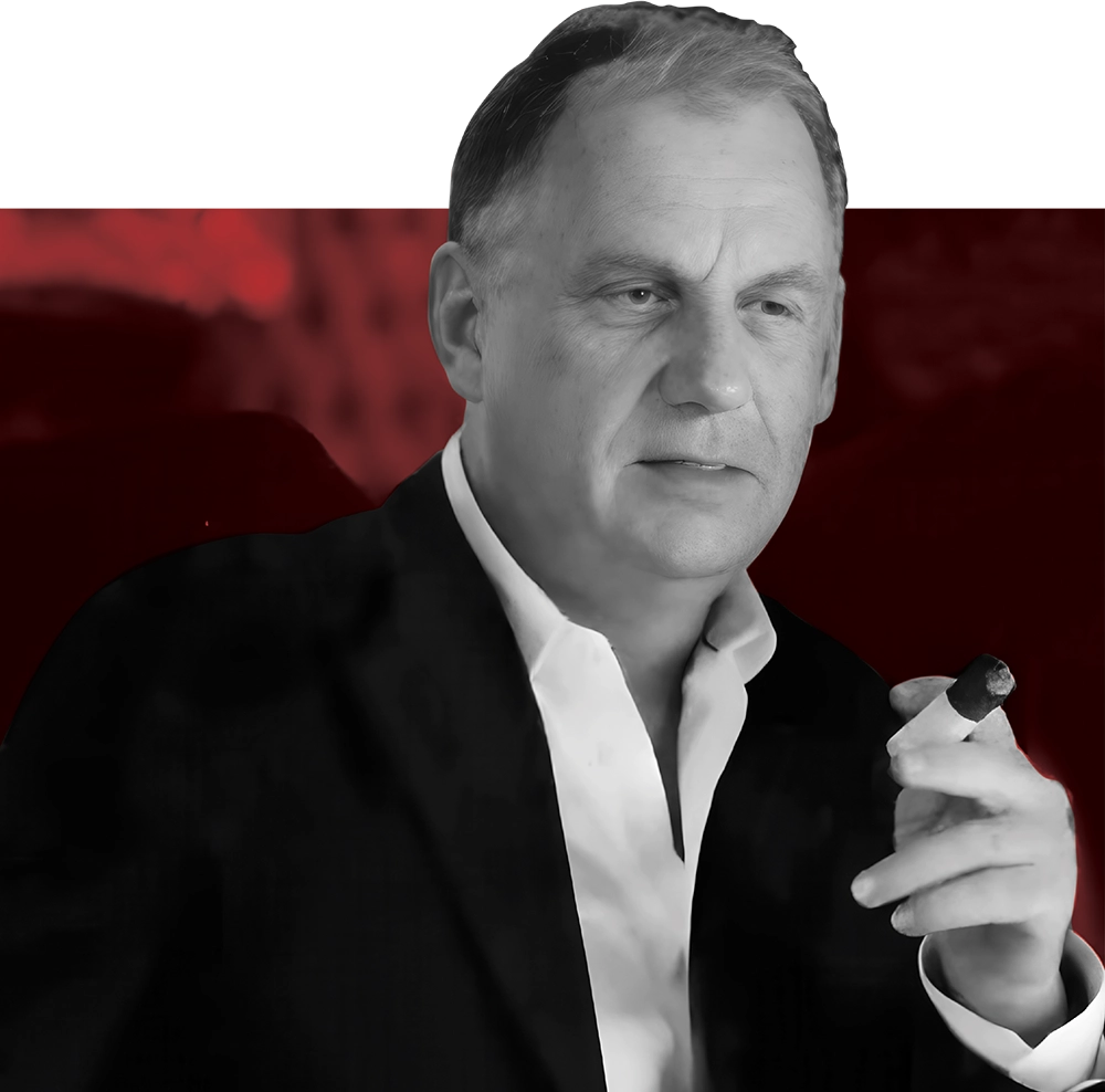 Portrait of a mature man in a dark suit and white shirt, holding a cigar.