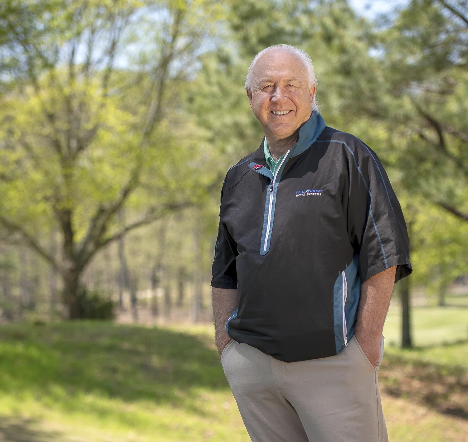 David Dodge wearing a Paramount Water Systems shirt and posing outdoors with his hands in his pockets