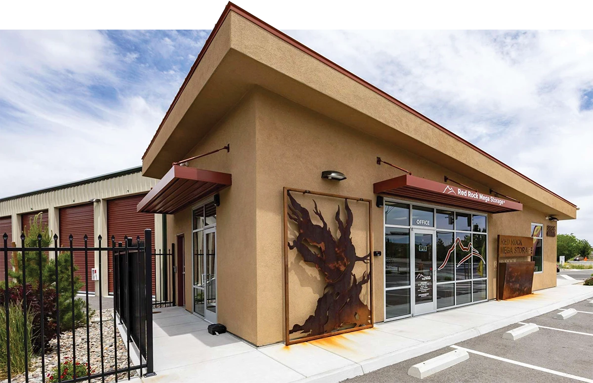 Storage facility office with rust-colored accents and decorative metal panel.