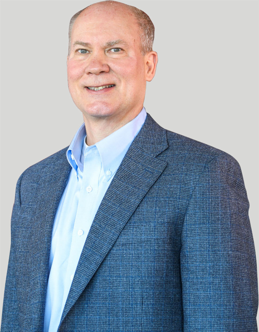 Christopher P. Marrr in gray suit jacket and white button up underneath