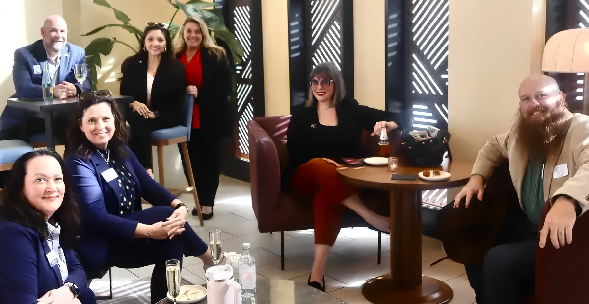 Jessie Lamb posing with others in the Conroe Chamber of Commerce at the Texas State Capitol