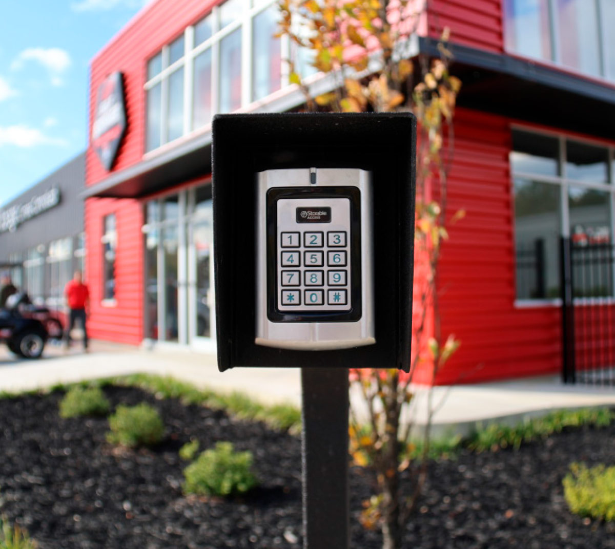 A close-up image of a keypad entry system at a storage facility.