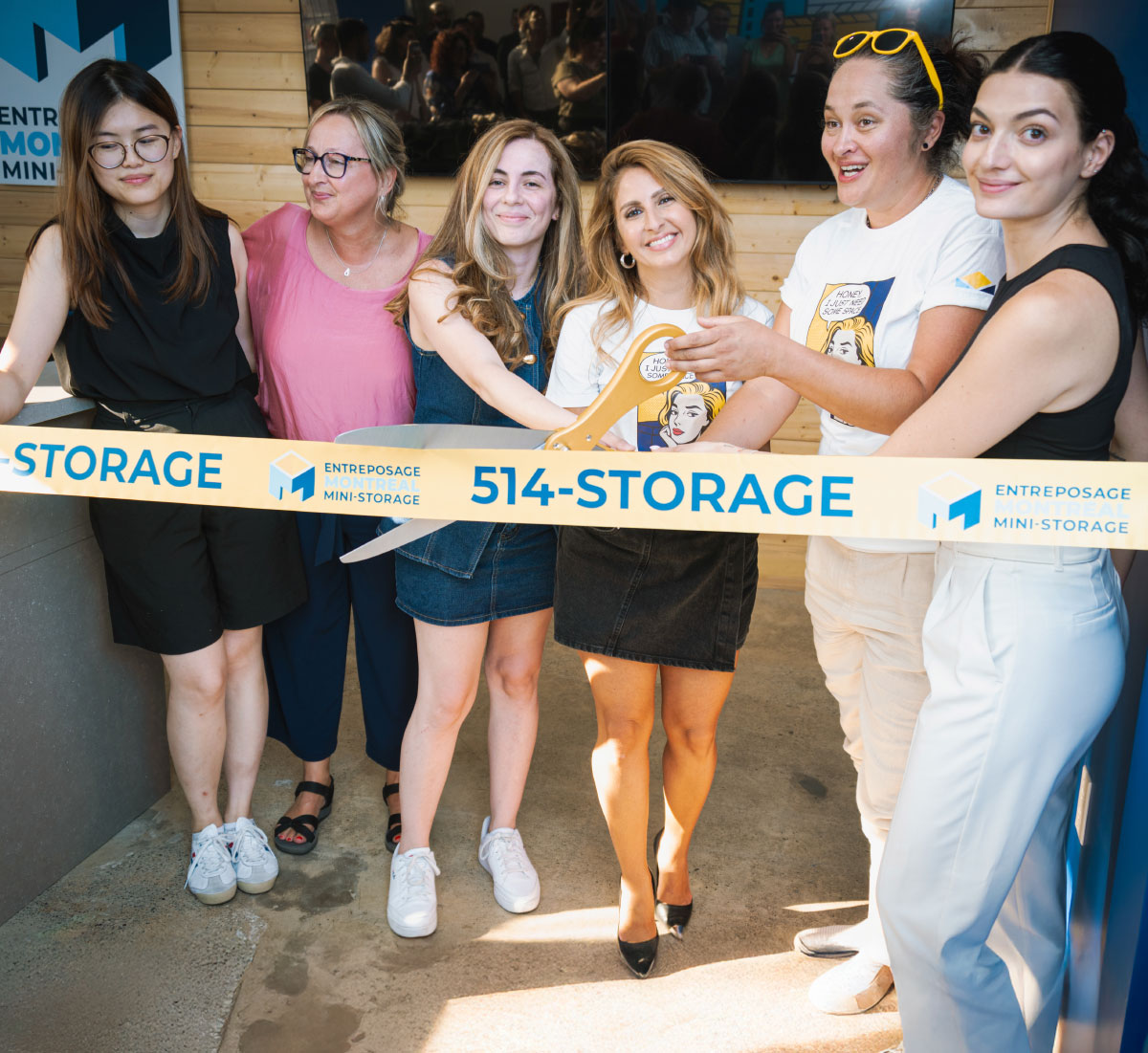 group of women cutting ribbon at ceremony