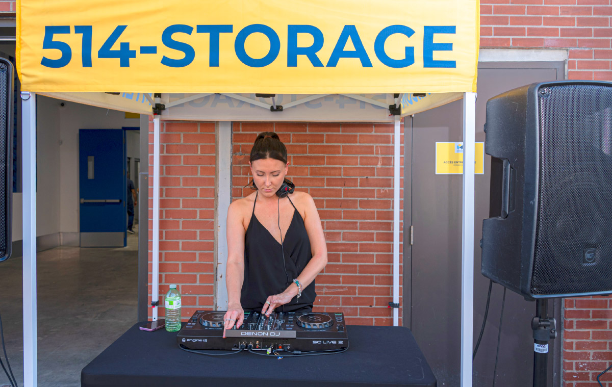 female DJ under canopy during event 