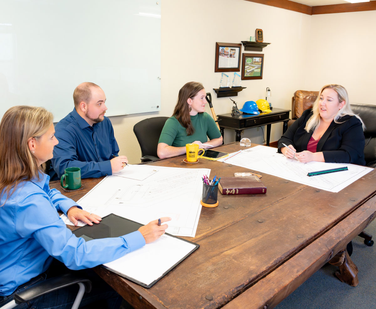 Rachel Parham at head of conference table during meeting