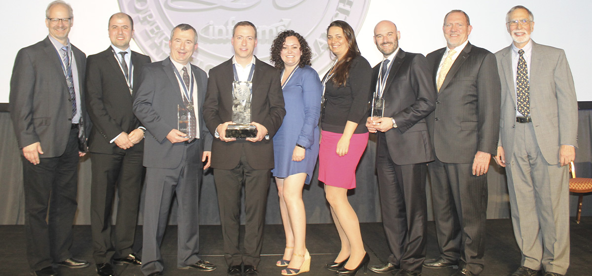 Dr. Ahmet Kuyumcu and his colleagues accept the Franz Edleman Award 