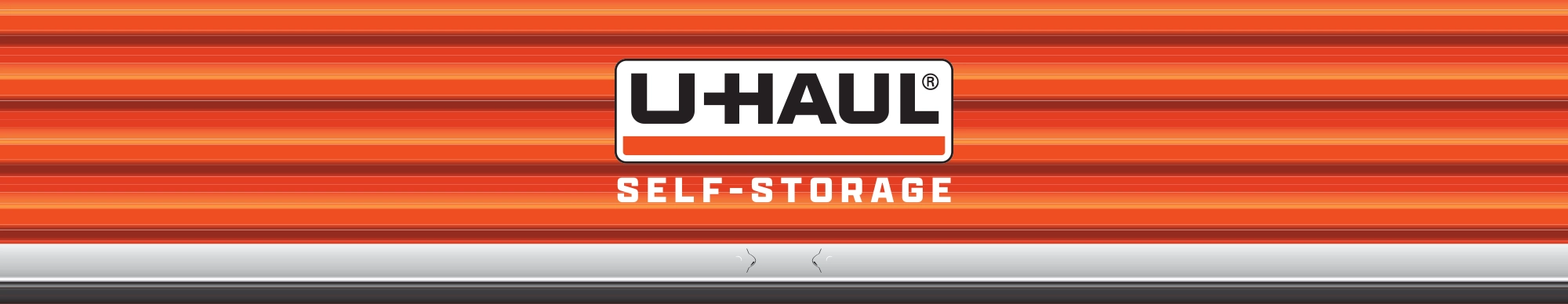 A wide U-Haul Self-Storage banner featuring the official black and orange U-Haul logo centered on a background of orange horizontal corrugated metal textures