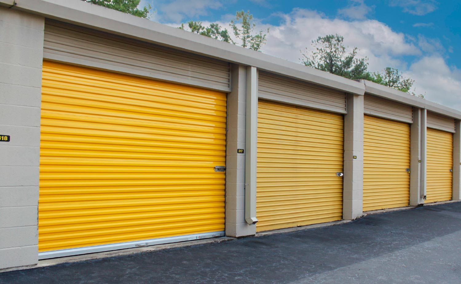 row of yellow outdoor storage units