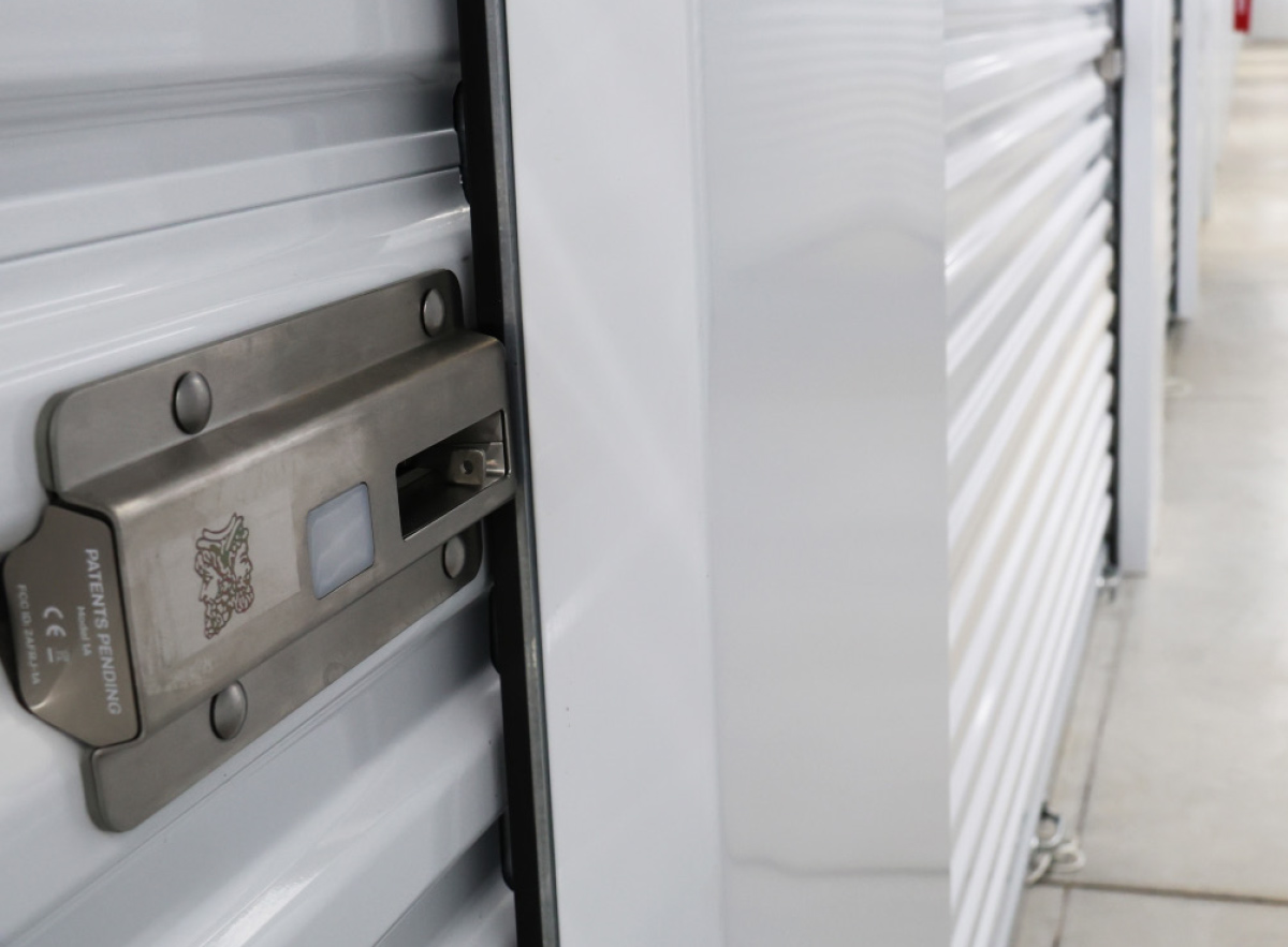 Close-up of a modern electronic smart lock system installed on a StoreEase self-storage unit door.