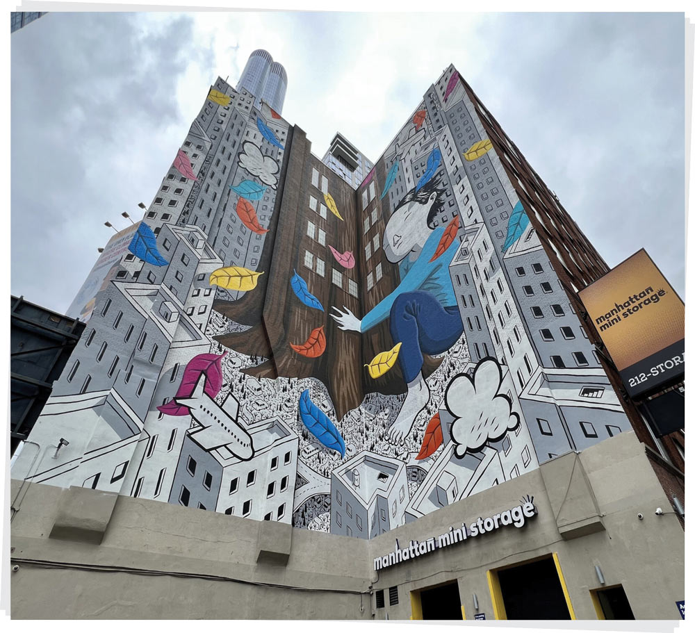 A high-rise Manhattan Mini Storage building covered in a massive graphic illustration of a person and falling leaves.