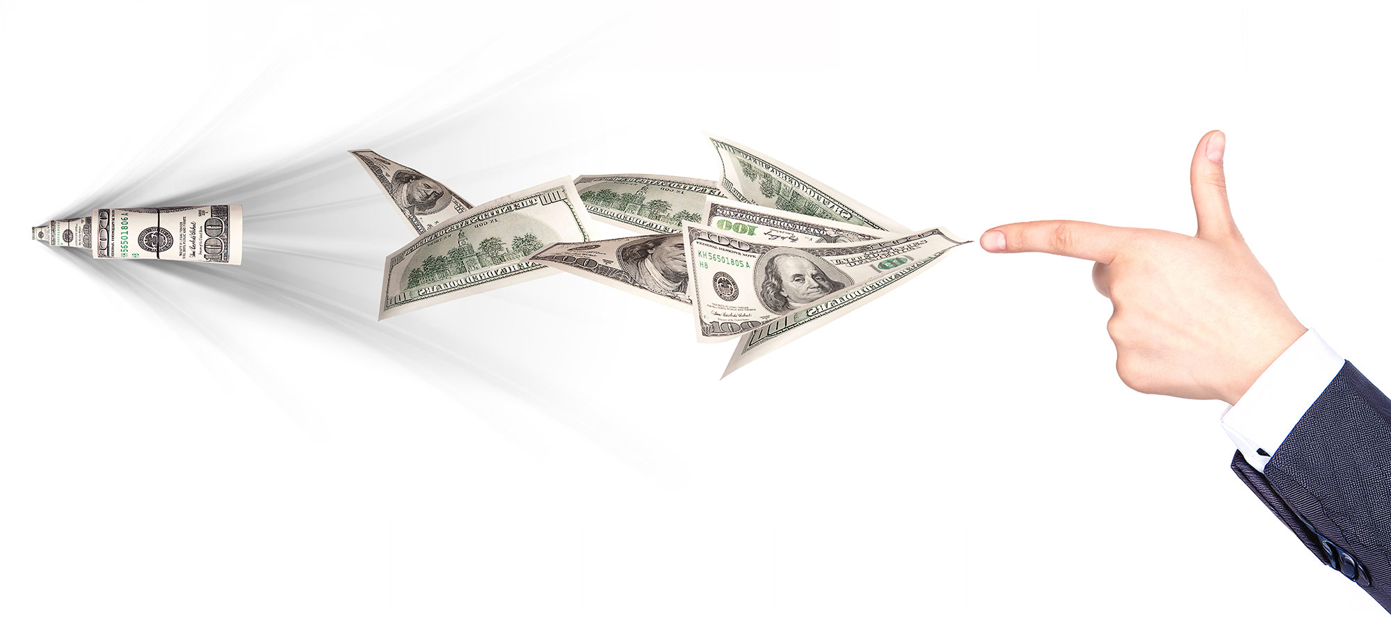 A finger gun pointing at US hundred-dollar bills folded into flying paper airplanes.