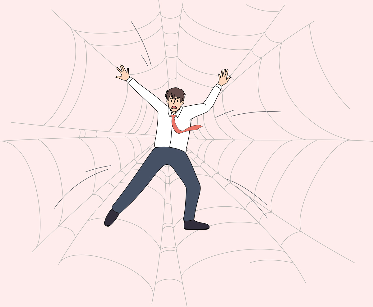 An illustration of a panicked businessman trapped inside a giant spiderweb.