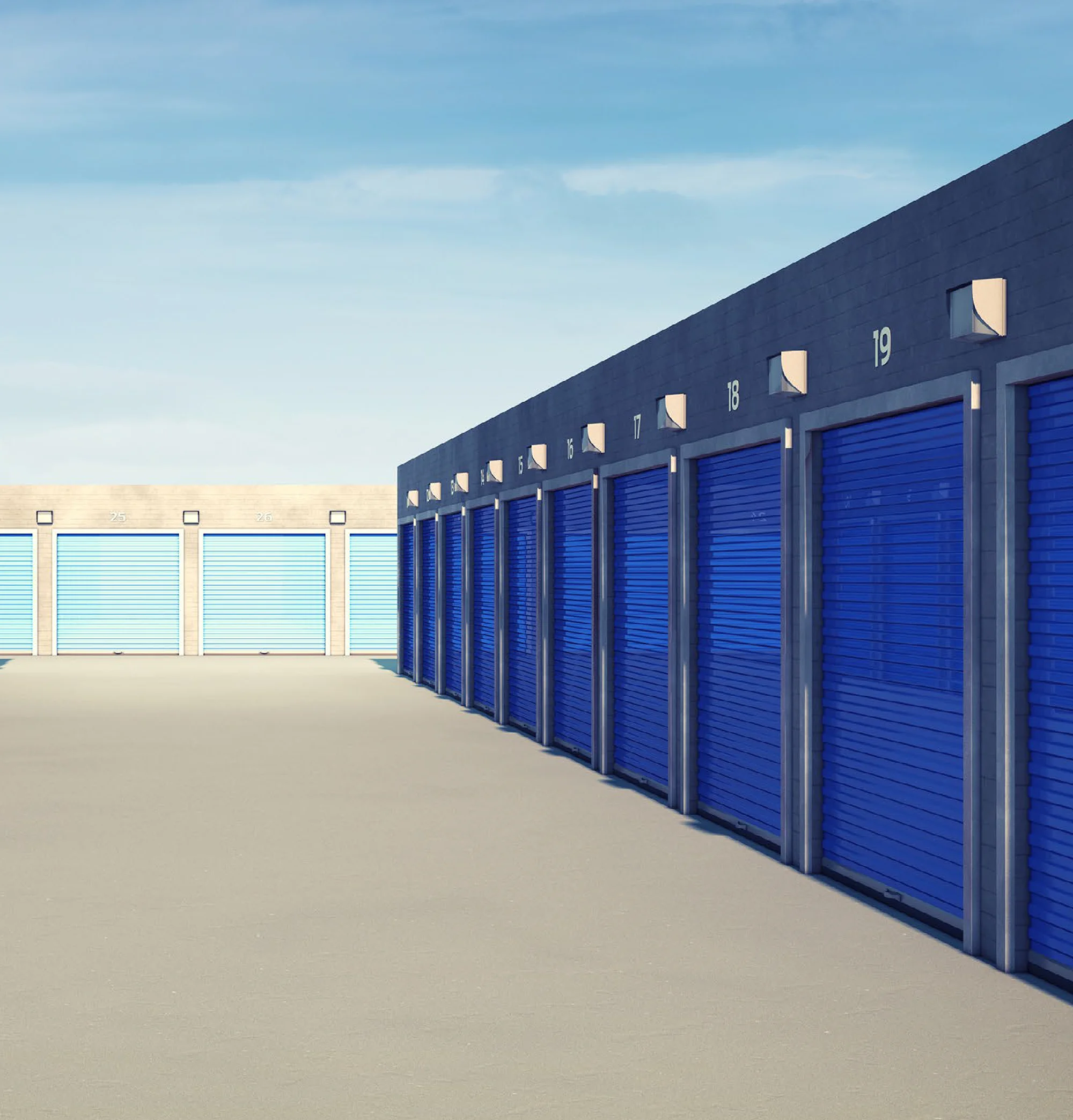 Row of self-storage units with blue doors.