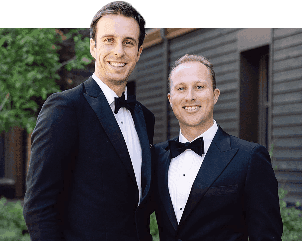 Ryan Chapman and Clay Jones wearing formal tuxedos.