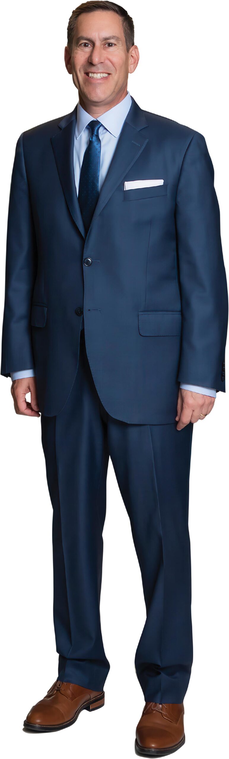 Professional portrait of Scott Zucker in a navy blue suit.