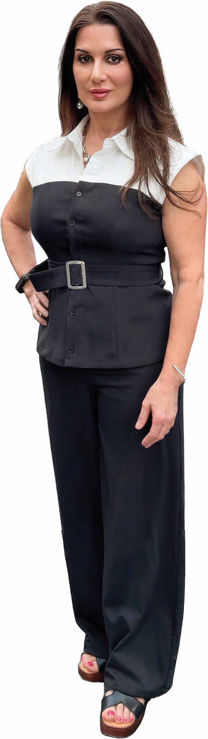 Portrait of Niki Bossonis wearing a black and white top and black pants.
