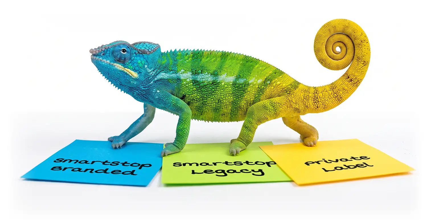A colorful chameleon transitioning from blue to green to yellow as it steps across matching blue, green, and yellow cards labeled "SmartStop Branded," "SmartStop Legacy," and "Private Label."